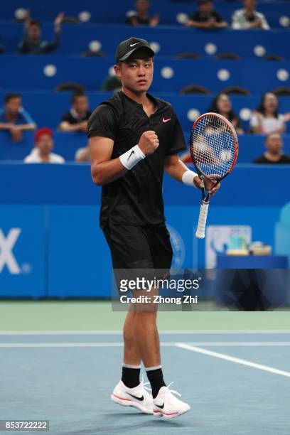 Yibing Wu of China celebrates a point during the match against Thiago Monteiro of Brazil during Day 1 of 2017 ATP Chengdu Open at Sichuan...