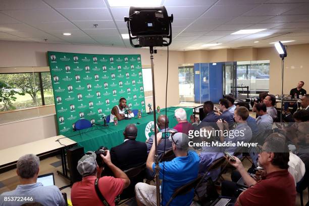 Kyrie Irving of the Boston Celtics answers questions from reporters during Boston Celtics Media Day at High Output Studios on September 25, 2017 in...