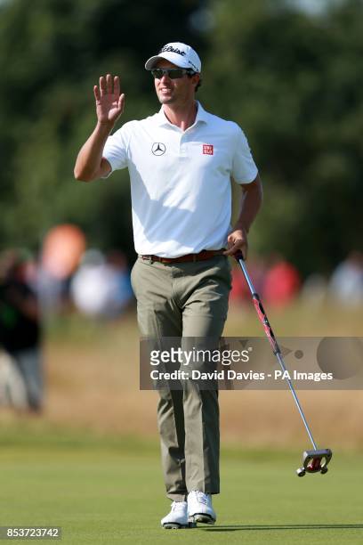 Australia's Adam Scott celebrates after he puts for a birdie on the 9th hole during day one of the 2014 Open Championship at Royal Liverpool Golf...
