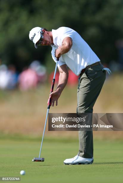 Australia's Adam Scott puts for a birdie on the 9th hole during day one of the 2014 Open Championship at Royal Liverpool Golf Club, Hoylake.