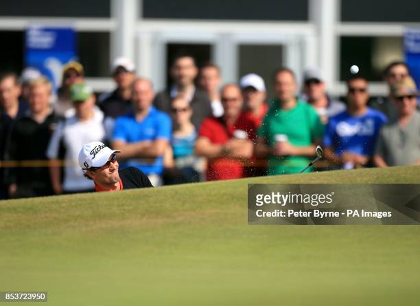 Australia's Adam Scott chips out of a bunker during day two of the 2014 Open Championship at Royal Liverpool Golf Club, Hoylake.