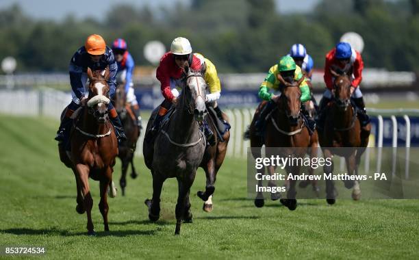 Cay Dancer ridden by jockey Richard Hughes comes home to win the Al Basti Equiworld TBA Fillies' Handicap at Newbury Racecourse, Newbury.