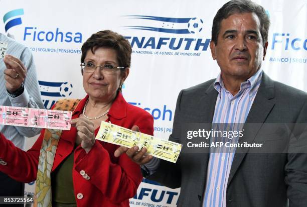 Mexican ambassador to Honduras, Dolores Jimenez , and the coach of the Honduran national football team, Colombian Jorge Luis Pinto, display the...