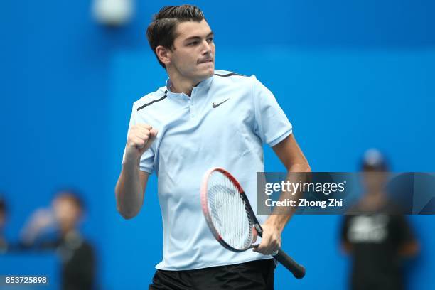 Taylor Fritz of the United States celebrates a shot during the match against Di Wu of China during Day 1 of 2017 ATP Chengdu Open at Sichuan...