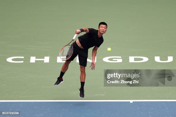 Di Wu of China serves during the match against Taylor Fritz of the United States during Day 1 of 2017 ATP Chengdu Open at Sichuan International...