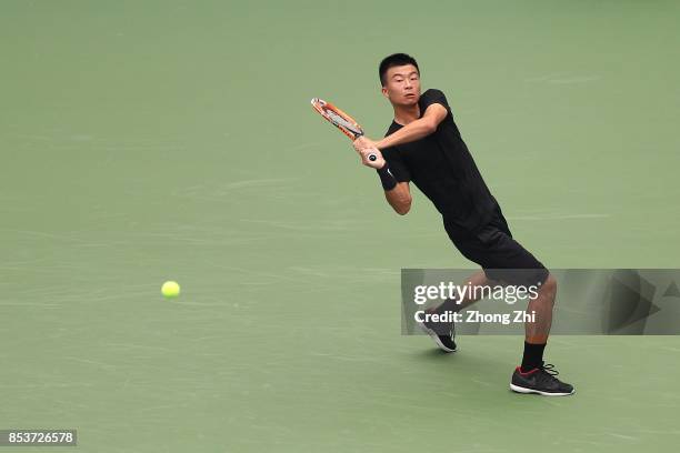 Di Wu of China returns a shot during the match against Taylor Fritz of the United States during Day 1 of 2017 ATP Chengdu Open at Sichuan...