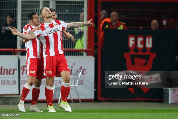 Sebastian Polter of Berlin jubilates with team mates after scoring the third goal during the Second Bundesliga match between 1. FC Union Berlin and...