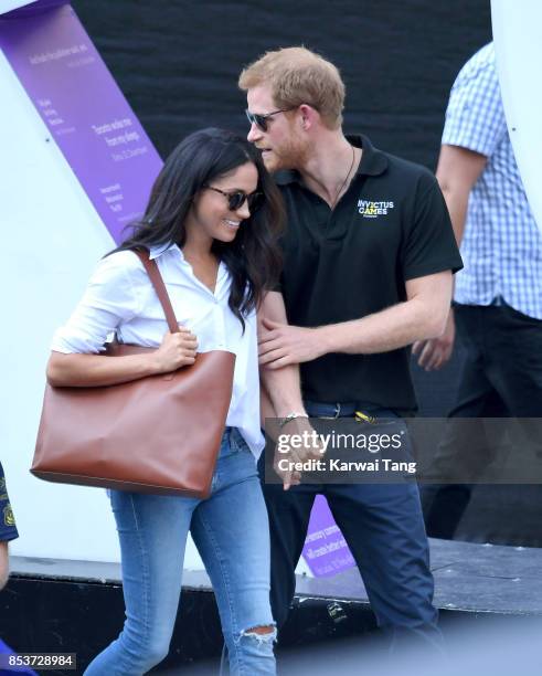 Meghan Markle and Prince Harry hold hands the Wheelchair Tennis on day 3 of the Invictus Games Toronto 2017 at Nathan Philips Square on September 25,...