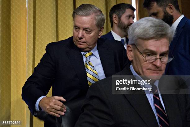 Senator Lindsey Graham, a Republican from South Carolina, left, walks past Senator Bill Cassidy, a Republican from Louisiana, right, during a Senate...