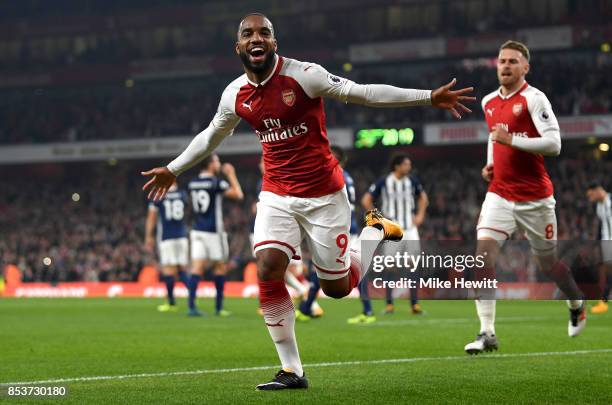 Alexandre Lacazette of Arsenal celebrates as he scores their first goal during the Premier League match between Arsenal and West Bromwich Albion at...