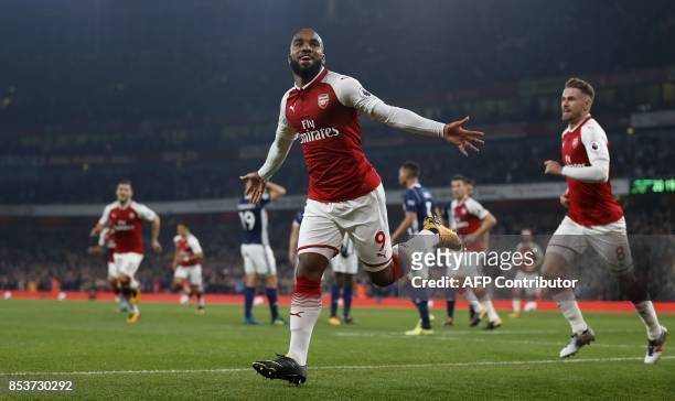 Arsenal's French striker Alexandre Lacazette celebrates scoring his team's first goal during the English Premier League football match between...