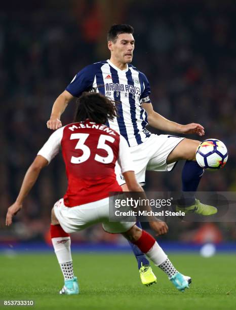 Gareth Barry of West Bromwich Albion is faced by Mohamed Elneny of Arsenal during the Premier League match between Arsenal and West Bromwich Albion...