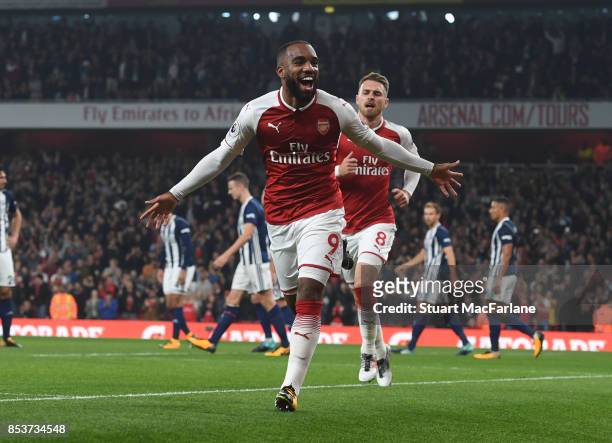 Alex Lacazette of Arsenal celebrates scoring for Arsenal during the Premier League match between Arsenal and West Bromwich Albion at Emirates Stadium...