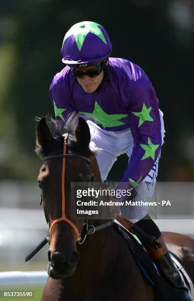 Marshall Jennings ridden by jockey Richard Hughes goes to post in the Highclere Thoroughbred Racing EBF Stallions Maiden Stakes at Newbury...
