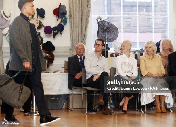The Duchess of Cornwall with model Anna Freemantle and her husband Jonathan Freemantle as they watch a fashion show during a visit to the Edinburgh...