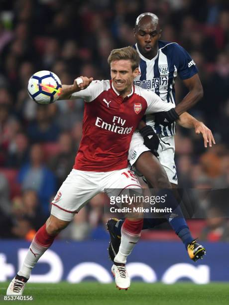 Allan Nyom of West Bromwich Albion and Nacho Monreal of Arsenal battle for the ball during the Premier League match between Arsenal and West Bromwich...
