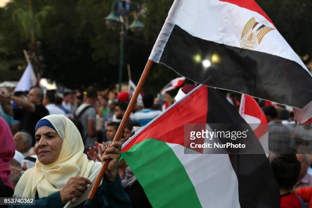 Palestinians wave the Egyptian flags during a rally to say ''Thank'' to Egypt for its support for Palestinian reconciliation, in Gaza city on...