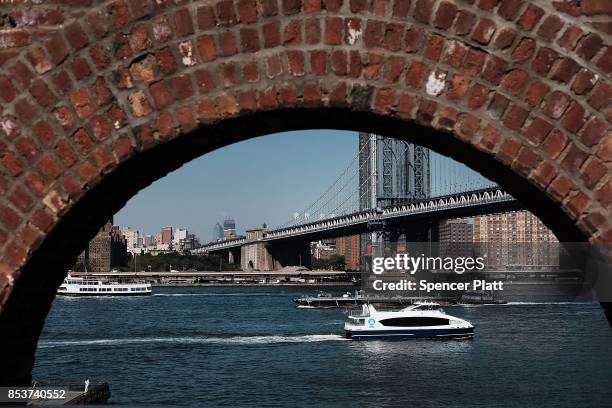 Boats move along the East River on an unseasonably warm afternoon on September 25, 2017 in New York City. Despite officially entering fall last week,...