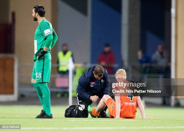 Ludvig Ohman Silwerfeldt of Athletic FC Eskilstuna gets attention from medical team during the Allsvenskan match between Athletic FC Eskilstuna and...