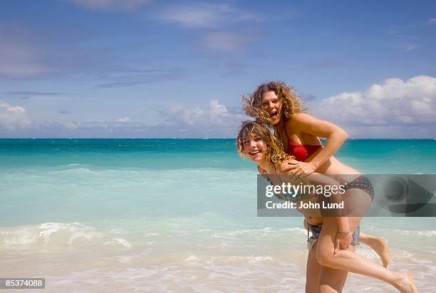 mother and daughter on hawaiian beach - hawaii vacation and parent and teenager stock pictures, royalty-free photos & images