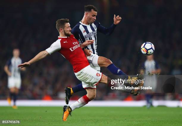 Hal Robson-Kanu of West Bromwich Albion and Shkodran Mustafi of Arsenal battle for the ball during the Premier League match between Arsenal and West...