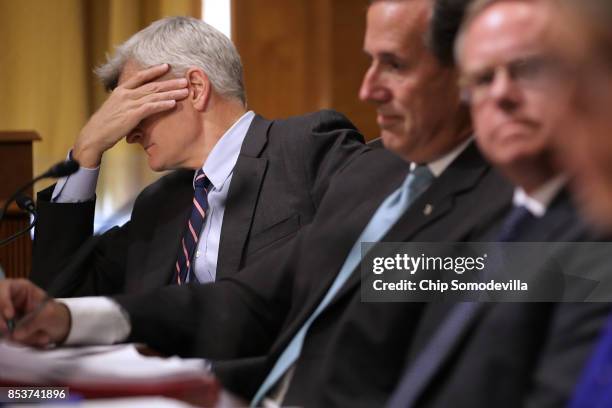 Senate Finance Committee member Sen. Bill Cassidy listens to fellow pannelists and witnesses during a hearing about the proposed Graham-Cassidy...