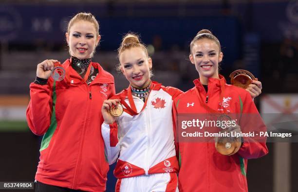 Silver medal winner Wales' Francesca Jones, gold medal winner Canada's Patricia Bezzoubenko and bronze medal winner Wales' Laura Halford with their...