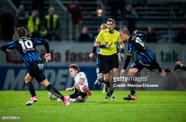 Victor Skold of Orebro SK falls against Christer Gustafsson of IK Sirius FK during the Allsvenskan match between IK Sirius FK and Orebro SK at...