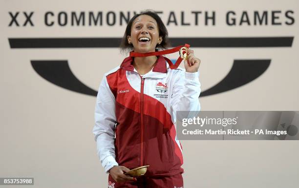 England's Zoe Smith with her gold medal after winning the womens 58kg weightlifting, at the Clyde Auditorium during the 2014 Commonwealth Games in...