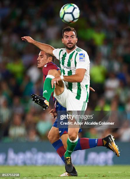 Jordi Amat of Real Betis Balompie competes for the ball with Alex Alegria of Levante UD during the La Liga match between Real Betis and Levante at...