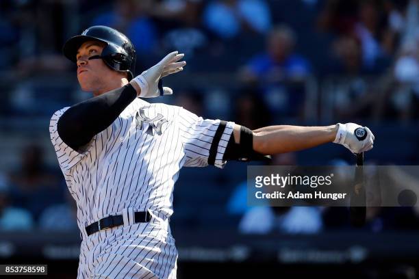 Aaron Judge of the New York Yankees hits a solo home run against the Kansas City Royals during the seventh inning at Yankee Stadium on September 25,...