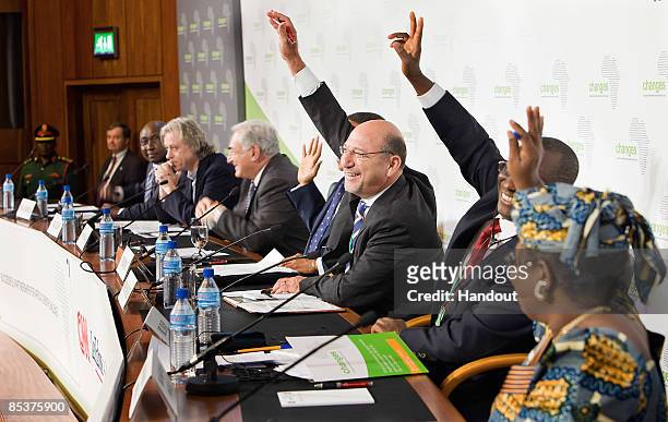 In this handout image provided by the IMF , President of African Development Bank Group Donald Kaberuka, Bob Geldof, International Monetary Funds...