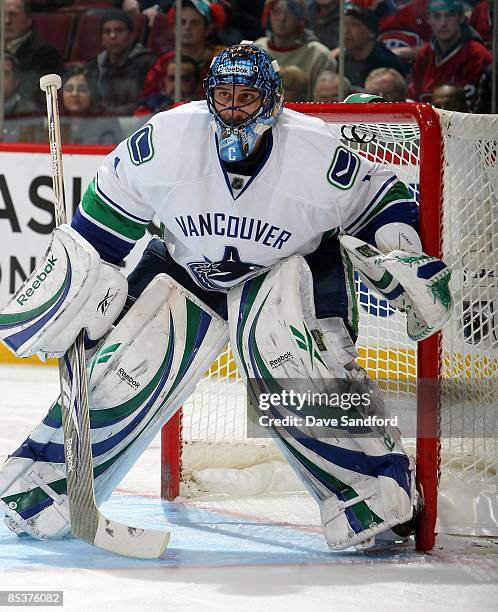 Roberto Luongo of the Vancouver Canucks watches play against the Montreal Canadiens during the NHL game at the Bell Centre on February 24, 2009 in...