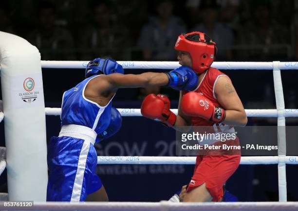 India's Laishram Devi in action against Mozambique's Maria Machongua in the Women's Light Semi-final 2 at the SECC, during the 2014 Commonwealth...