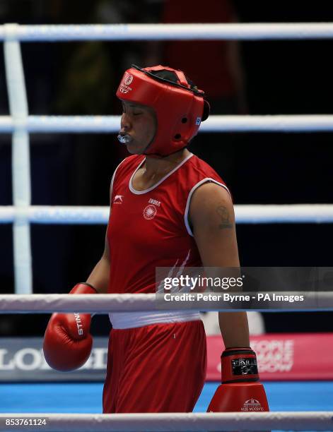 India's Laishram Devi in action against Mozambique's Maria Machongua in the Women's Light Semi-final 2 at the SECC, during the 2014 Commonwealth...