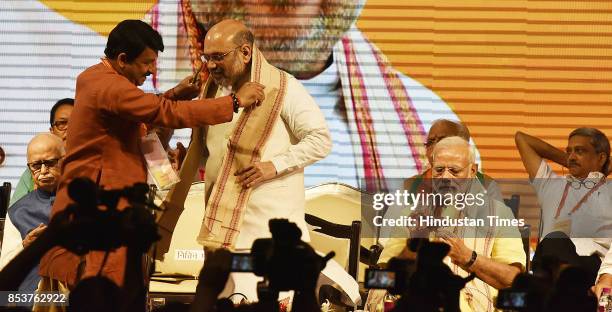 Leader Manoj Tewari welcomes to party President Amit Shah, Prime Minister Narendra Modi, during the BJP national executive meeting at Talkatora...