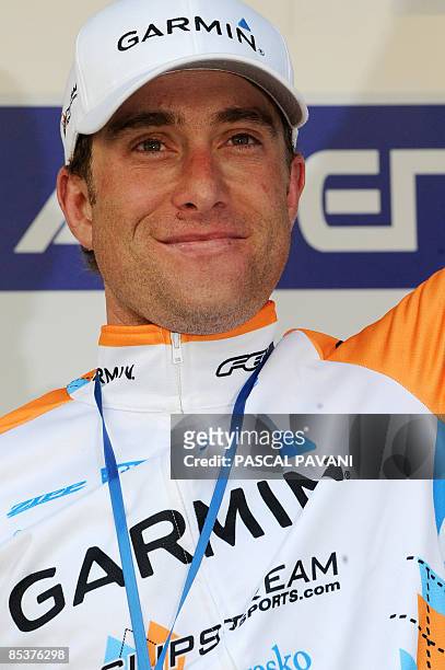 Christian Vandevelde jubilates on the podium on March 11, 2009 after winning the 173,5 km fourth stage of the 2009 Paris-Nice cycling race run...