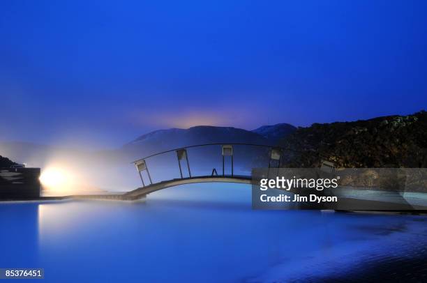 View of the famous Blue Lagoon spa where tourists and locals gather for geothermal bathing in the silica rich waters, on the Reykjanes Peninsula on...