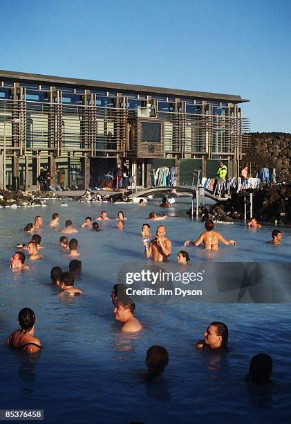 View of the famous Blue Lagoon spa where tourists and locals gather for geothermal bathing in the silica rich waters, on the Reykjanes Peninsula on...