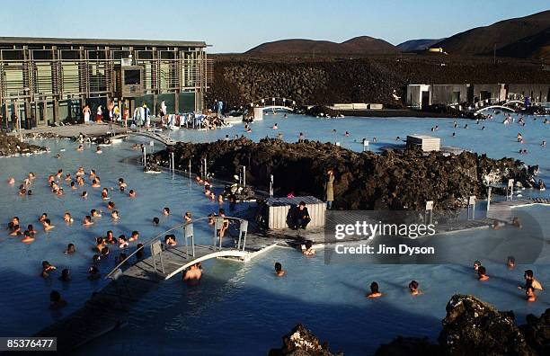 View of the famous Blue Lagoon spa where tourists and locals gather for geothermal bathing in the silica rich waters, on the Reykjanes Peninsula on...