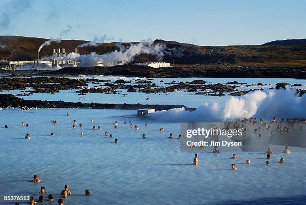 View of the famous Blue Lagoon spa where tourists and locals gather for geothermal bathing in the silica rich waters, on the Reykjanes Peninsula on...