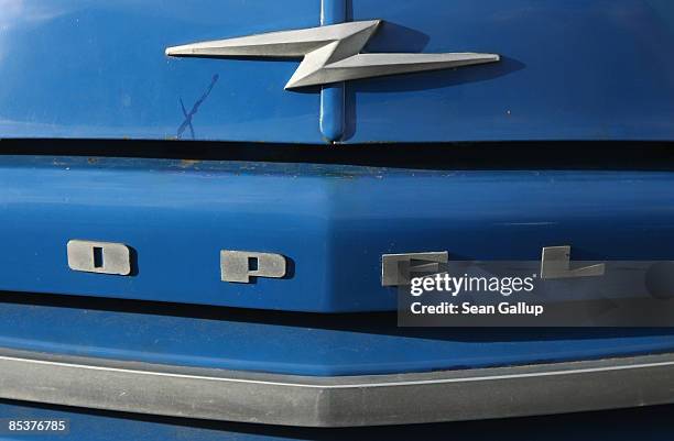 The lightning logo of German automaker Opel is visible on the hood of a 1957 Opel truck at the workshop of Opel-enthusiast Hilmar Born on March 11,...