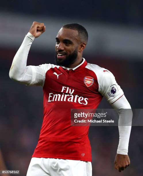 Alexandre Lacazette of Arsenal celebrates as he scores their second goal from a penalty during the Premier League match between Arsenal and West...