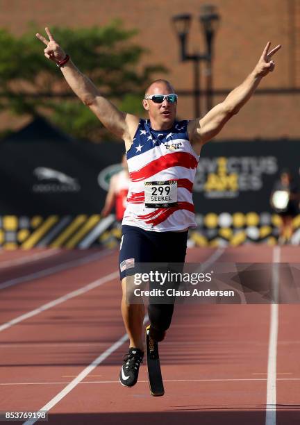Ben Seekell of the United States celebrates after winning gold in the Men's IT1 400m Final during Day Three of the Invictus Games 2017 at York Lions...