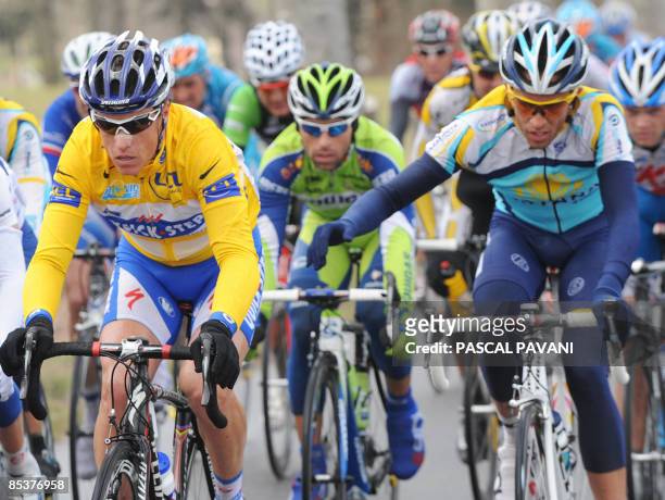 New yellow jersey of overall leader, French Sylvain Chavanel , rides with third placed and 2007 Tour de France winner Spanish Alberto Contador on...