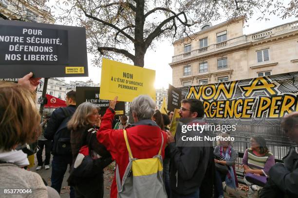 Protesters rally to protest against 'permanent state of emergency' in Paris on September 25 in front of the French National Assembly. The French...