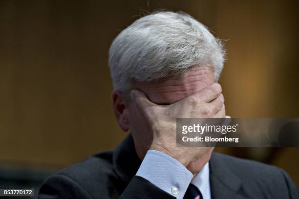 Senator Bill Cassidy, a Republican from Louisiana, rubs his face during a Senate Finance Committee hearing to consider the...
