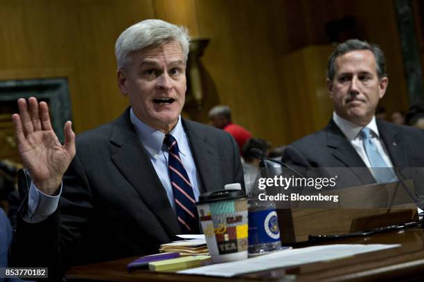 Senator Bill Cassidy, a Republican from Louisiana, left, speaks during a Senate Finance Committee hearing to consider the...