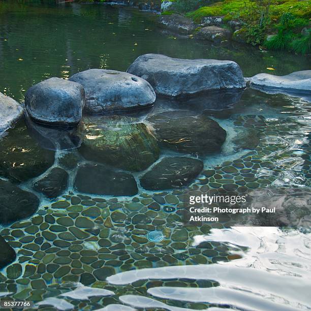indulge in a hotspring bath - izu peninsula stock pictures, royalty-free photos & images