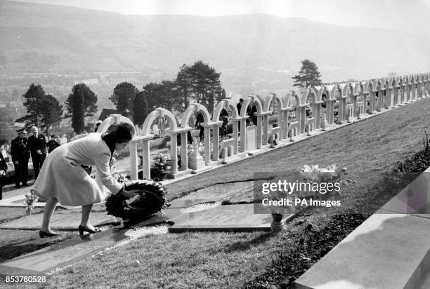 The Queen lays a wreath to commemorate the victims of the Aberfan disaster of 1966.